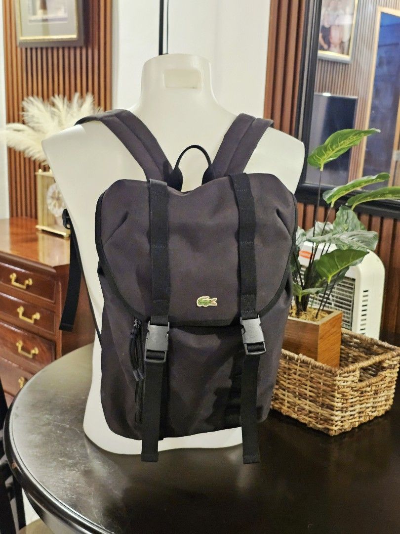 Lacoste Backpack (Category: Backpacks) located in Makati City. Submitted by richpaul_ (Listing ID 1453546689, Image 1). Description: - Stylish black roll-top backpack - Comfortable padded mesh back panel - Adjustable shoulder straps for a perfect fit - Durable material built to last - Ample interior space for all your essentials - Ideal for daily use, work, or travel adventures.