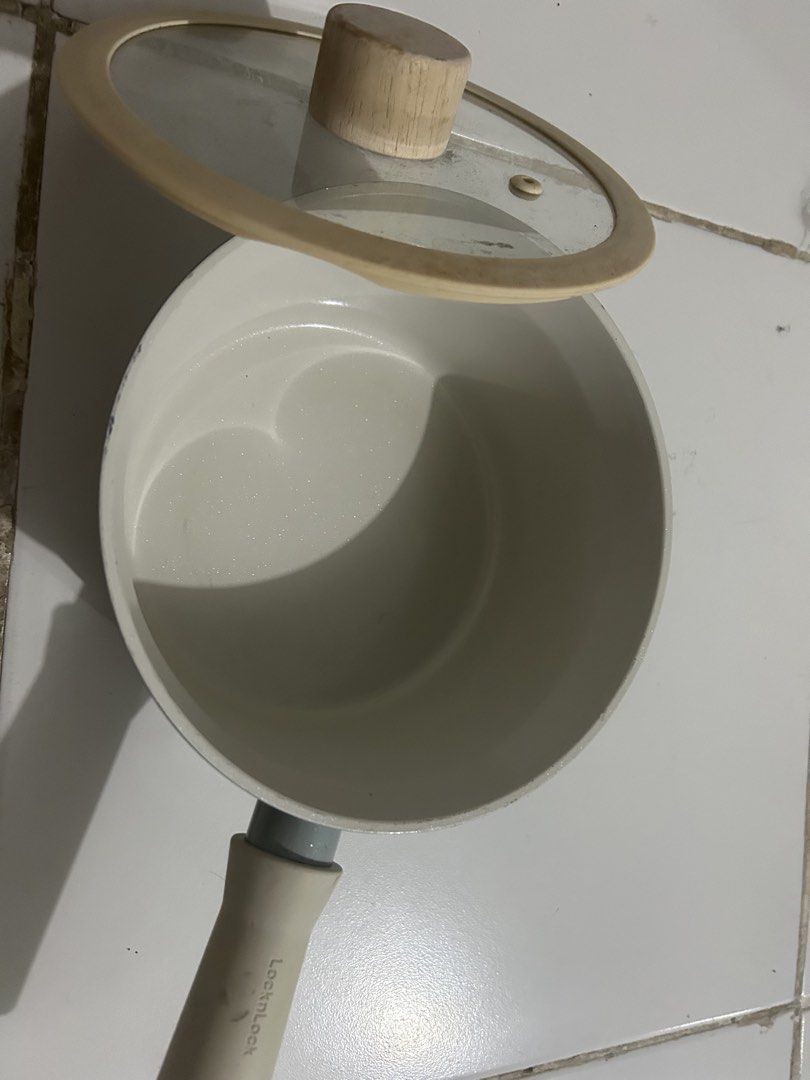 LocknLock Induction Compatible Saucepan with Glass Lid (Category: Cookware & Accessories) located in Angeles City. Submitted by kimkant06043026 (Listing ID 1453620570, Image 2). Description: - LocknLock saucepan with glass lid - Features a wooden knob on the lid - Induction cooktop compatible bottom - Ideal for heating sauces or small portions - Ergonomic handle for comfortable grip - Minor signs of use on the inside - Sold as is.