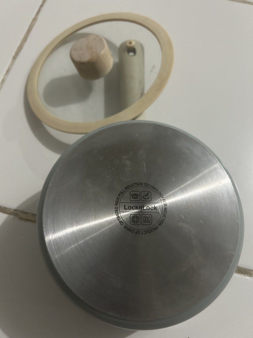 LocknLock Induction Compatible Saucepan with Glass Lid (Category: Cookware & Accessories) located in Angeles City. Submitted by kimkant06043026 (Listing ID 1453620570, Image 1). Description: - LocknLock saucepan with glass lid - Features a wooden knob on the lid - Induction cooktop compatible bottom - Ideal for heating sauces or small portions - Ergonomic handle for comfortable grip - Minor signs of use on the inside - Sold as is.