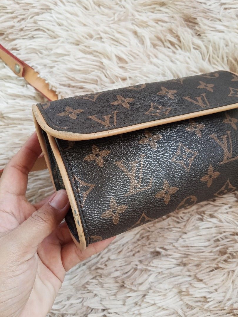 Louis Vuitton Monogram Canvas Waist Bag Pouch (Category: Luxury Bags & Wallets) located in Zamboanga. Submitted by reg_ukay_shopp (Listing ID 1453511312, Image 3). Description: - Features tan leather trim and adjustable strap. - Secure magnetic snap closure. - Interior lined with durable brown fabric. - Bag edges exhibit some signs of use. - Ideal for convenient, hands-free carrying..