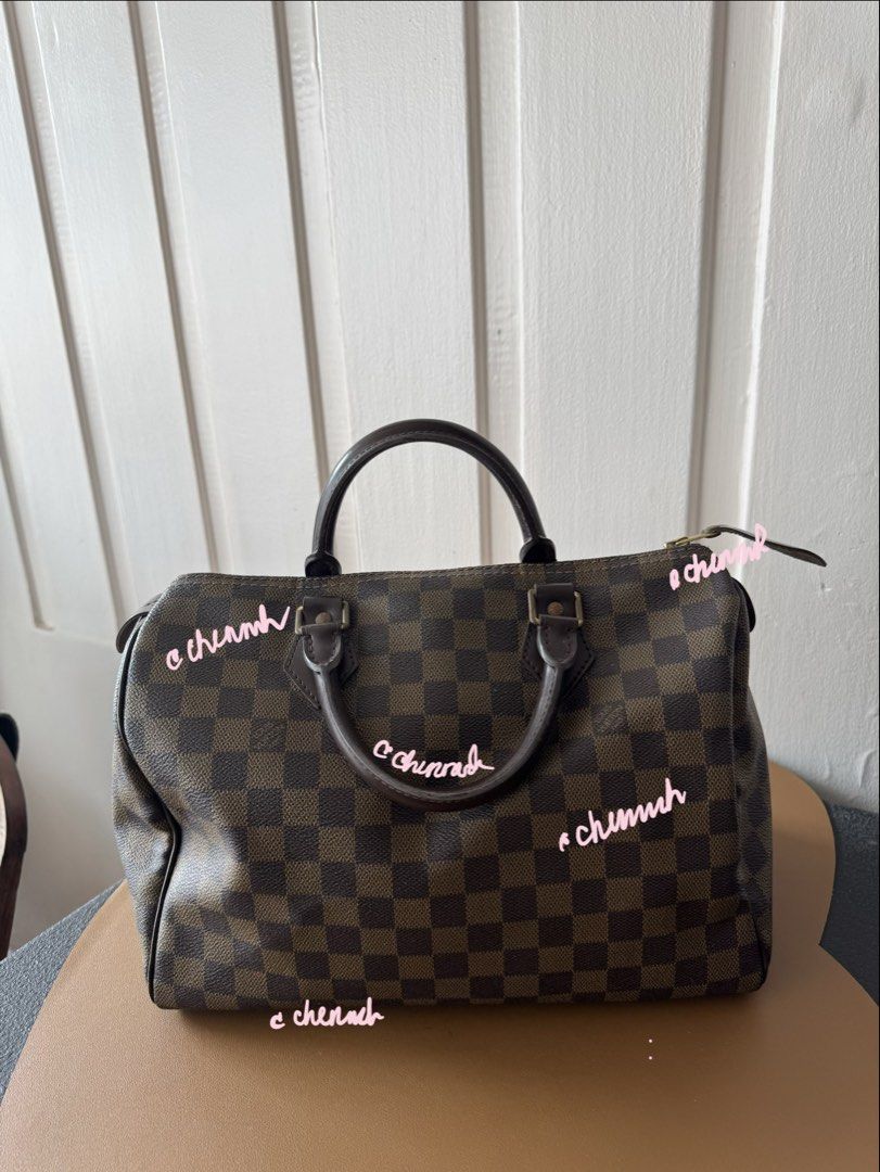 Louis Vuitton Speedy Damier Ebene Canvas Handbag (Category: Luxury Bags & Wallets) located in Pasig City. Submitted by jennasantos (Listing ID 1453442482, Image 2). Description: - Authentic Classic Louis Vuitton Speedy bag - Damier Ebene canvas with iconic checkered pattern - Genuine leather handles and trim - Secure zipper closure - Spacious red interior lining - Ideal for everyday use Shipping from Pasig - fee to be shouldered by buyer Shipping