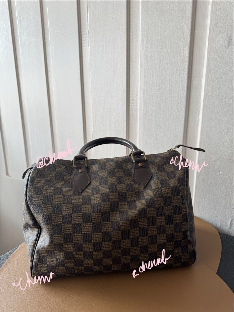 Louis Vuitton Speedy Damier Ebene Canvas Handbag (Category: Luxury Bags & Wallets) located in Pasig City. Submitted by jennasantos (Listing ID 1453442482, Image 1). Description: - Authentic Classic Louis Vuitton Speedy bag - Damier Ebene canvas with iconic checkered pattern - Genuine leather handles and trim - Secure zipper closure - Spacious red interior lining - Ideal for everyday use Shipping from Pasig - fee to be shouldered by buyer Shipping