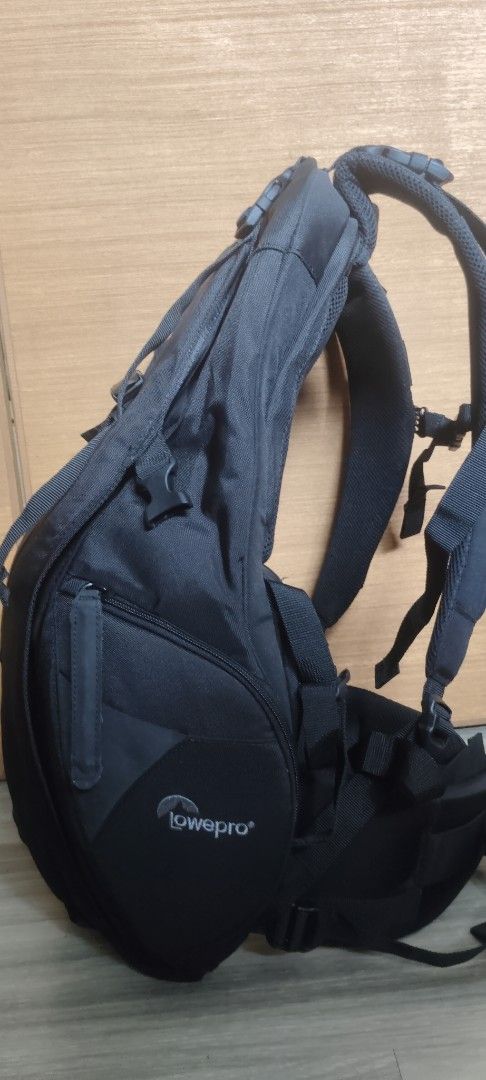 Lowepro Black Backpack with Polar Bear Patch (Category: Backpacks) located in San Mateo. Submitted by roxyj120919 (Listing ID 1453430669, Image 3). Description: - Black Lowepro backpack - 50th Anniversary Edition with unique polar bear patch - Multiple pockets and straps for organized gear storage - Includes a protective rain cover - Ideal for travel and photography enthusiasts.