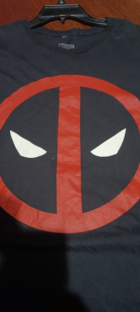 Marvel Deadpool Big Logo Black T-Shirt (Category: Tshirts & Polo Shirts ) located in Malabon City. Submitted by solerevolutionph (Listing ID 1453599195, Image 3). Description: - Black Marvel t-shirt featuring the iconic Deadpool mask graphic. - Made from 100% comfortable cotton. - Tagged as size L. - Approximate measurements: 21 inches across the chest, 29 inches in length. - Ideal casual wear for any Marvel enthusiast. 21 x 29 Size: Large 9/10 D