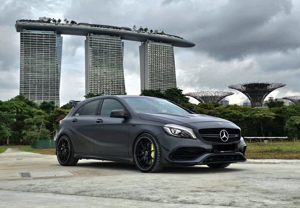 Mercedes-Benz A-Class A45 AMG (A) (Category: Used Cars) located in Singapore. Submitted by omgedwin (Listing ID 1453485094, Image 1). Description: - Powered by an AMG hand built 2.0L turbocharged engine - Stage one tuned producing 410bhp with 550nm of torque - 7 speed AMG speed shift DCT - Electric memory seats - AMG exclusive designo Selenite Grey Magno paintwork - Carbon fibre bonnet with subtle CF upgrades - 19 Inch Rays VR Rims with PS4S tire