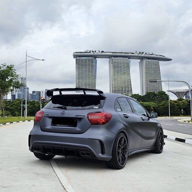Mercedes-Benz A-Class A45 AMG (A) (Category: Used Cars) located in Singapore. Submitted by omgedwin (Listing ID 1453485094, Image 2). Description: - Powered by an AMG hand built 2.0L turbocharged engine - Stage one tuned producing 410bhp with 550nm of torque - 7 speed AMG speed shift DCT - Electric memory seats - AMG exclusive designo Selenite Grey Magno paintwork - Carbon fibre bonnet with subtle CF upgrades - 19 Inch Rays VR Rims with PS4S tire