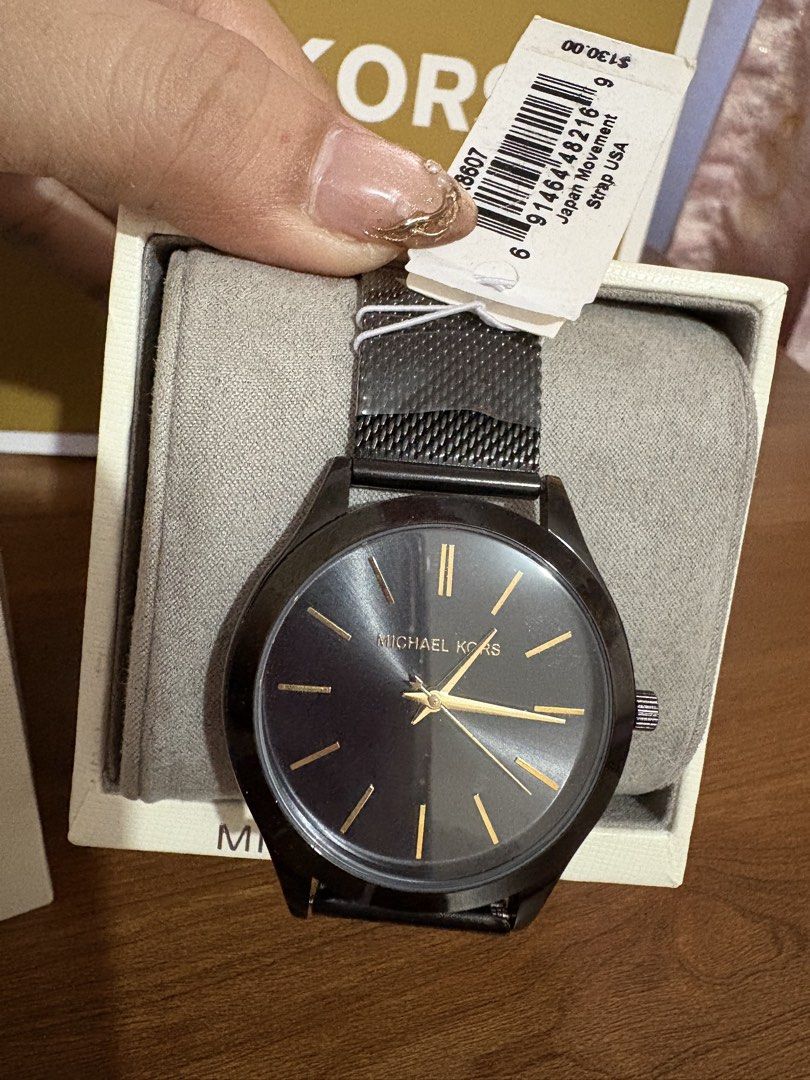 Michael Kors Black Mesh Strap Watch (Category: Women's Watches) located in Manila. Submitted by JAngel (Listing ID 1453475200, Image 2). Description: - Authentic Michael Kors Watch - Elegant Black Dial with Gold Hands & Markers - Stylish Gold Mesh Strap - Reliable Japan Movement - Comes with Original Box and Shopping Bag - Original Price Tag: $130.00.