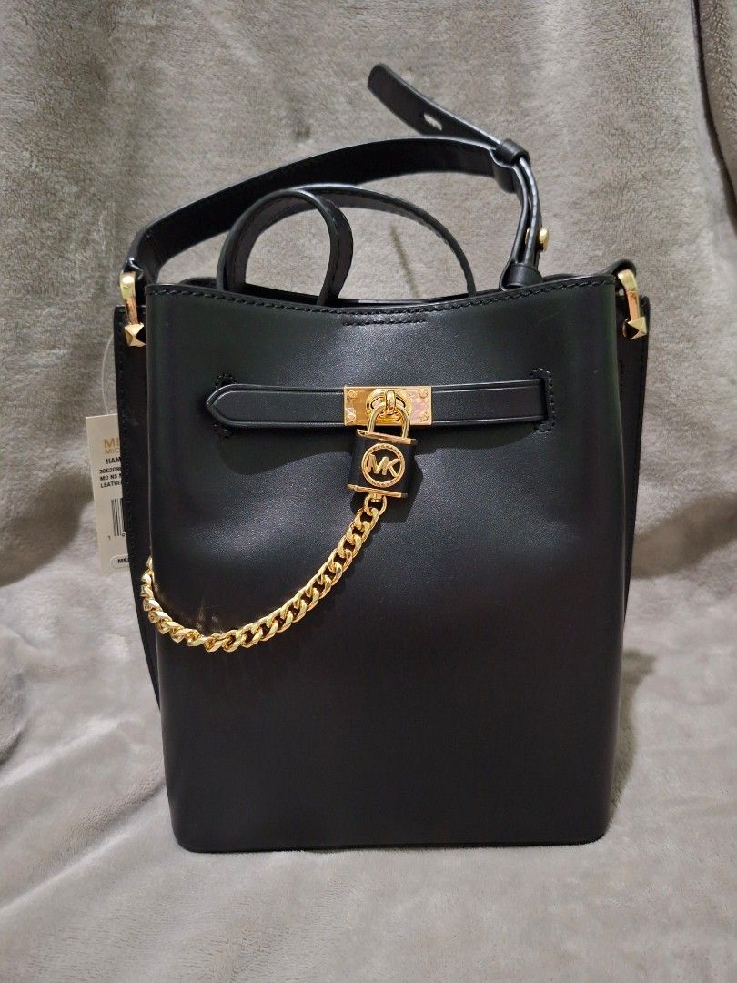 Michael Kors Hamilton Legacy Bucket Bag (Category: Luxury Bags & Wallets) located in Las Pinas. Submitted by ronabelles (Listing ID 1453517330, Image 1). Description: - Michael Kors Hamilton Legacy Bag - Medium Messenger Style - Genuine Black Leather - Gold Hardware & Chain Detail - Brand New with Original Tags - Never Used - Original MSRP: $498.00.