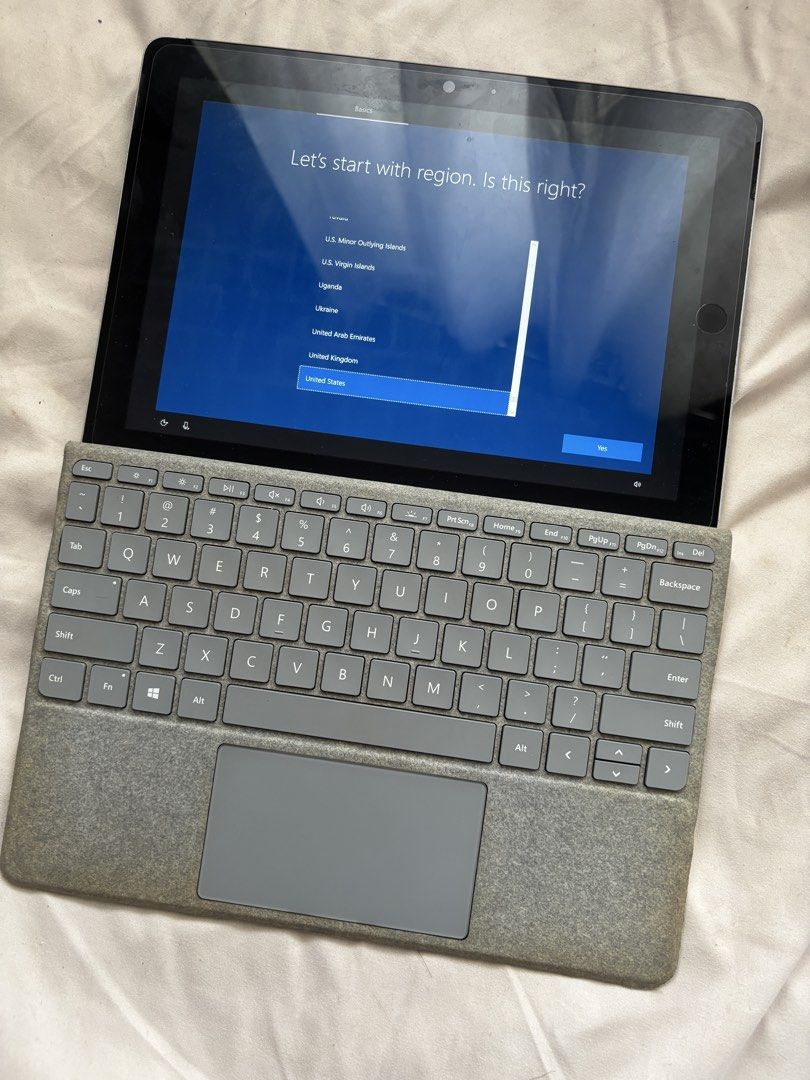 Microsoft Surface Go Tablet with Keyboard (Category: Laptops & Notebooks) located in Taguig. Submitted by arcjvcs (Listing ID 1453503507, Image 2). Description: - Microsoft Surface Go tablet - Includes grey fabric keyboard cover - Device is in setup mode, ready for a new user - Ideal for work or school - Lightweight and portable design.