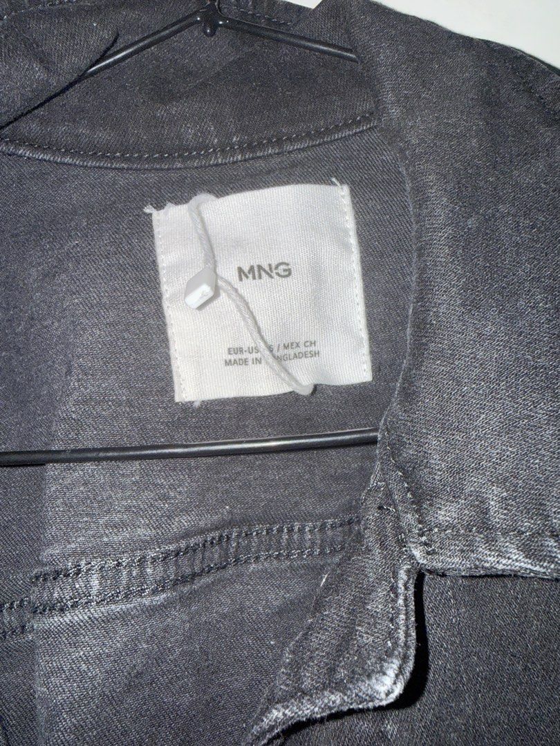 MNG Black Denim Jacket (Category: Coats, Jackets and Outerwear) located in Manila. Submitted by declutterwidme (Listing ID 1453439274, Image 2). Description: - Classic black denim jacket from MNG - Button-up front - Two chest pockets - Long sleeves with button cuffs - Essential wardrobe staple, easy to style.