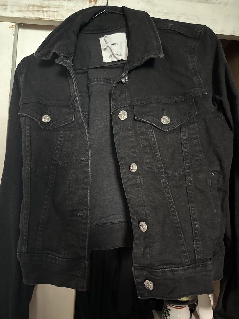 MNG Black Denim Jacket (Category: Coats, Jackets and Outerwear) located in Manila. Submitted by declutterwidme (Listing ID 1453439274, Image 1). Description: - Classic black denim jacket from MNG - Button-up front - Two chest pockets - Long sleeves with button cuffs - Essential wardrobe staple, easy to style.