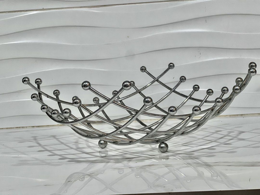 Modern Metal Wire Fruit Bowl Basket (Category: Vases & Decorative Bowls) located in Pateros City. Submitted by mcacompany (Listing ID 1453575906, Image 2). Description: - Stylish metal wire basket - Ideal for fruits or as a decorative piece - Promotes good air circulation with its open design - Shiny silver finish - Dimensions: Approx. [length] x [width] x [height] - Enhances kitchen counters or dining tables Find many great new & used options an