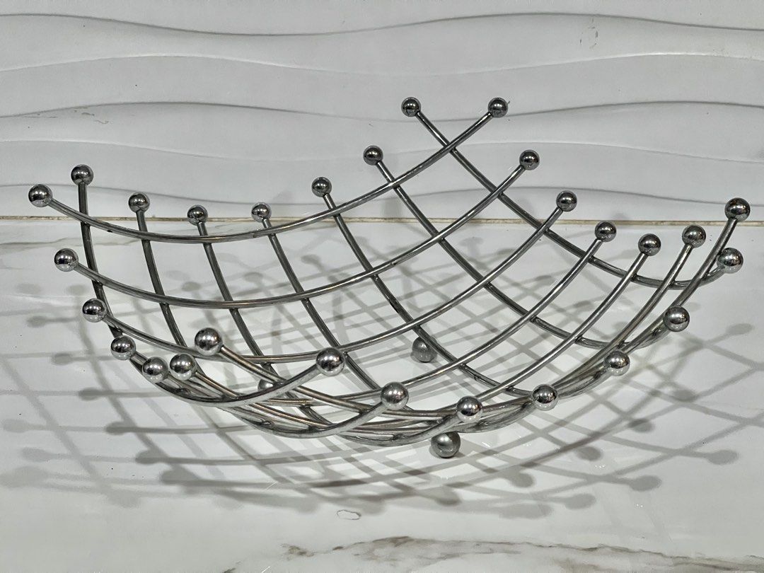 Modern Metal Wire Fruit Bowl Basket (Category: Vases & Decorative Bowls) located in Pateros City. Submitted by mcacompany (Listing ID 1453575906, Image 1). Description: - Stylish metal wire basket - Ideal for fruits or as a decorative piece - Promotes good air circulation with its open design - Shiny silver finish - Dimensions: Approx. [length] x [width] x [height] - Enhances kitchen counters or dining tables Find many great new & used options an