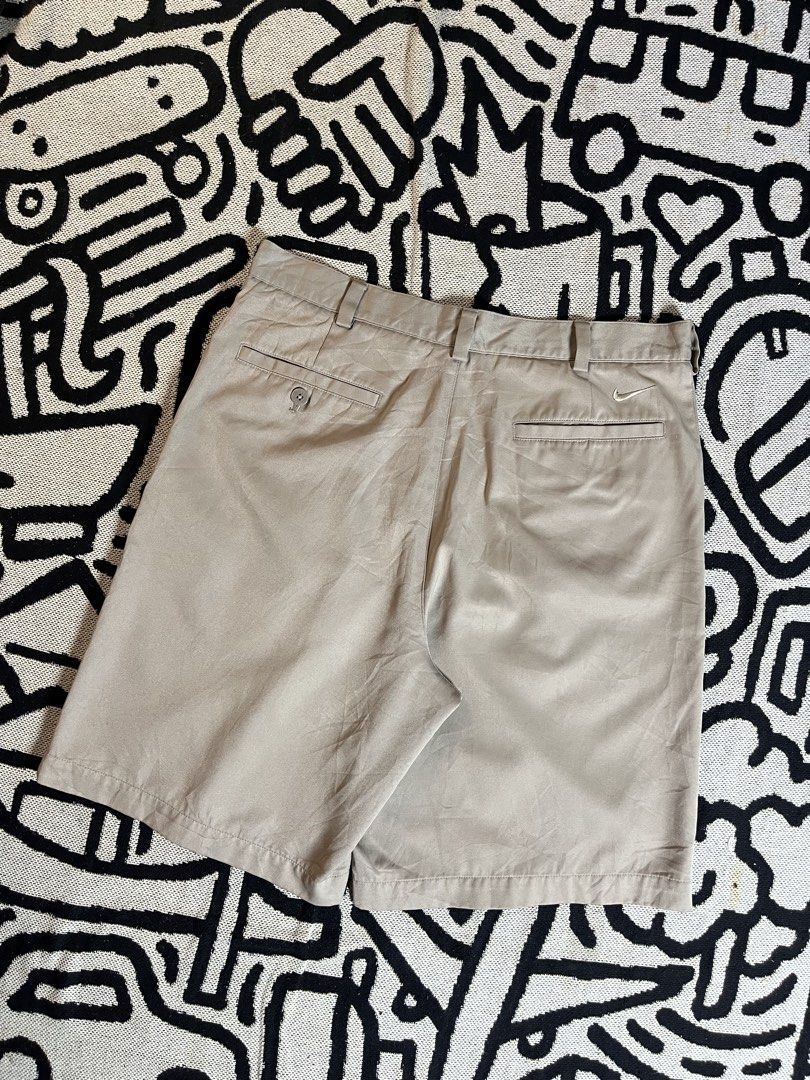 Nike Golf Beige Pleated Shorts Size 32 (Category: Shorts) located in Silang. Submitted by yusthrift (Listing ID 1453513318, Image 3). Description: - Beige Nike Golf Shorts - Size: 32 waist - Design: Pleated front - Closure: Button and zip - Pockets: Two side, two back - Ideal for: Golfing or casual wear - Features: Comfortable fit 15.5 inc waistline 20 inc length 11.5 inc leg opening Issue: Missing 1 button on waist On last pic .
