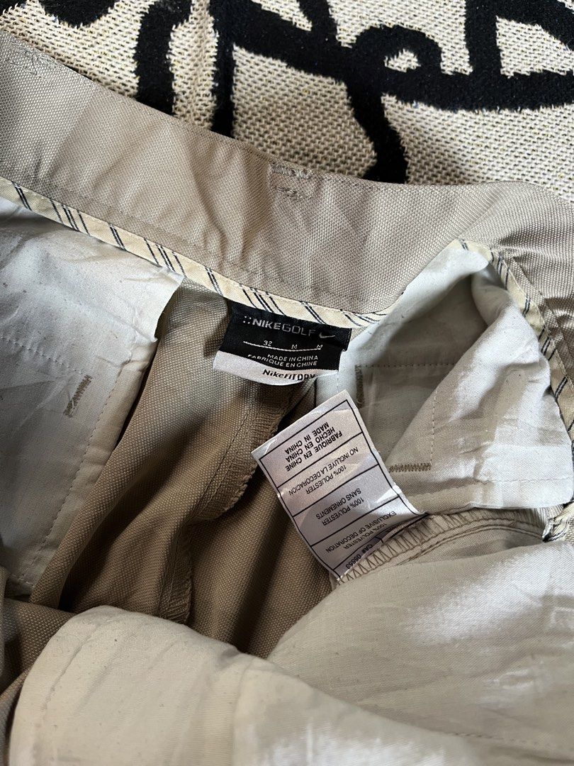 Nike Golf Beige Pleated Shorts Size 32 (Category: Shorts) located in Silang. Submitted by yusthrift (Listing ID 1453513318, Image 2). Description: - Beige Nike Golf Shorts - Size: 32 waist - Design: Pleated front - Closure: Button and zip - Pockets: Two side, two back - Ideal for: Golfing or casual wear - Features: Comfortable fit 15.5 inc waistline 20 inc length 11.5 inc leg opening Issue: Missing 1 button on waist On last pic .