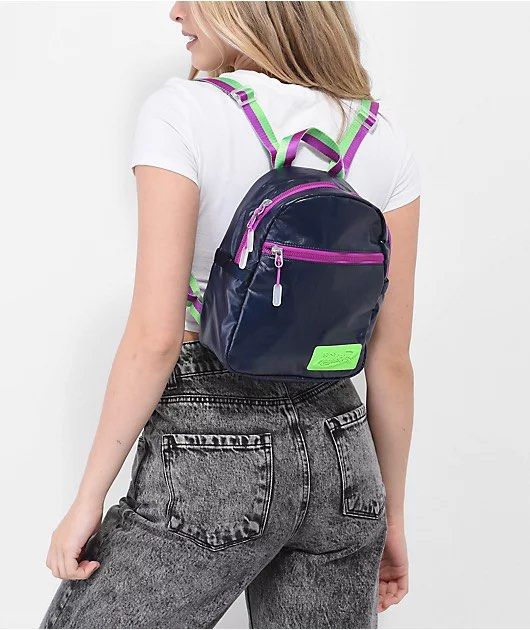 Nike Mini Backpack Navy Blue & Neon Green (Category: Backpacks) located in Apalit. Submitted by trishy.stuff (Listing ID 1453436115, Image 2). Description: - Cute mini backpack from Nike - Color: Navy blue with neon green and purple straps - only issue see the last photo ( zipper color little faded and yellowish nike bling) - Original price: 2499 - Selling price: 1200 - rfs: no longer need it and need funds.