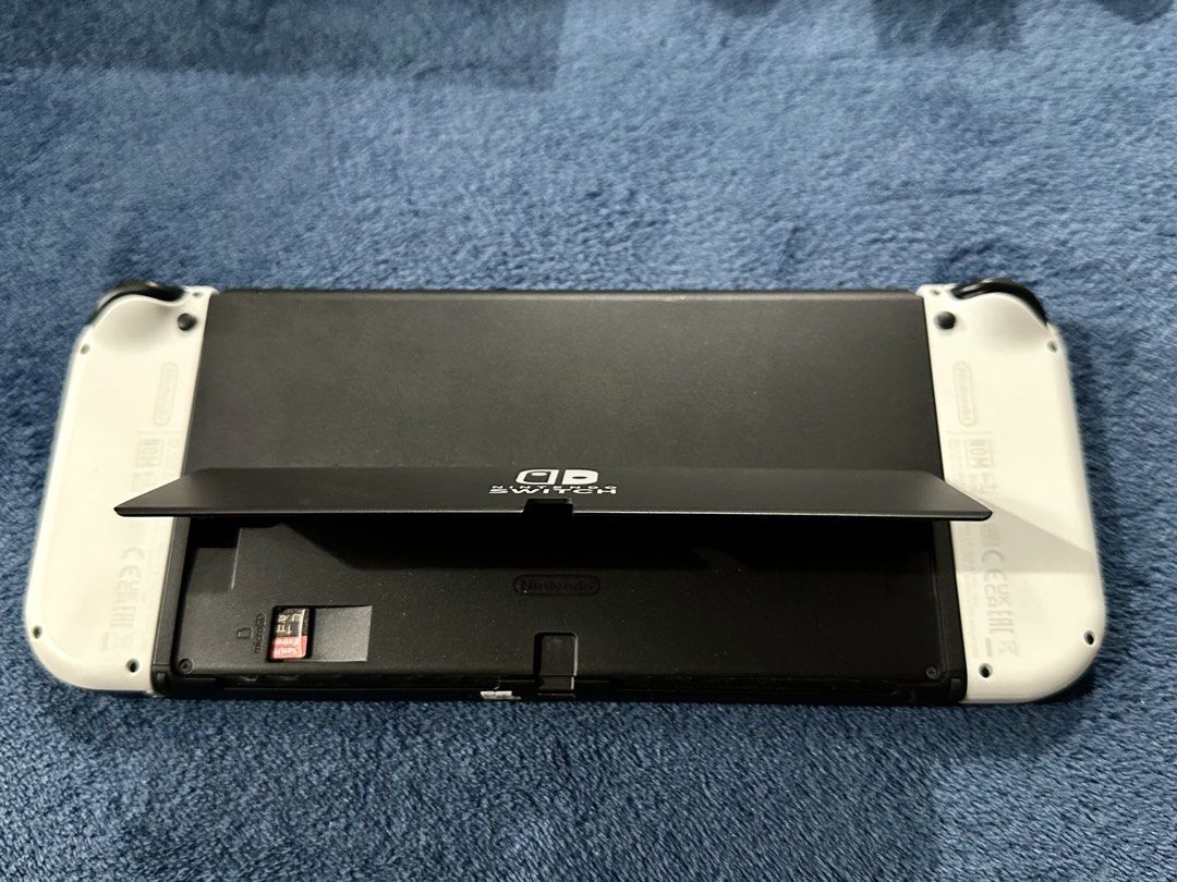 Nintendo Switch Oled - White (Category: Nintendo) located in Quezon City. Submitted by kylvrd (Listing ID 1453508228, Image 2). Description: Nintendo Switch OLED White Complete Set + Games 🎮 Selling my Nintendo Switch OLED (White) in excellent condition. It has been well taken care of and is working perfectly with no issues. 📦 Inclusions: * Nintendo Switch OLED Console (White) * Left & Right Joy-Con Controllers * Original Nintendo Switch Dock *