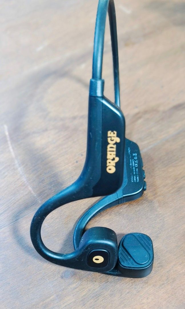 ORANGE 0 BONE headset (Category: Earphones) located in Quezon City. Submitted by gametz (Listing ID 1453617582, Image 3). Description: Original item pre loved item. - this is one of THE , THE BEST HEADPHONES YOULL EVER USE IN LAND OR WATER.... Authentic ORANGE O BONES headphone Orange O Bones bone conduction headphones featuring a black design and open-ear technology. Technology: Uses bone conduction to transmit sound, allowing you to hear surrou