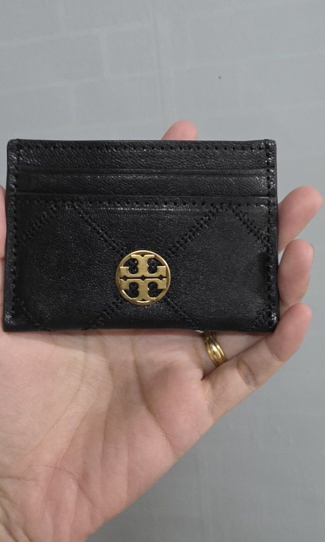 Original Tory Burch Black Quilted Leather Cardholder (Category: Wallets & Card holders) located in Pasig City. Submitted by lfboutique (Listing ID 1453148789, Image 2). Description: - Tory Burch black quilted leather cardholder no cod pasig loc original and bnew no inclusion thus selling low - Iconic gold-tone logo hardware - Multiple card slots for organization - Compact and stylish for everyday use - Perfect for keeping essential cards handy.