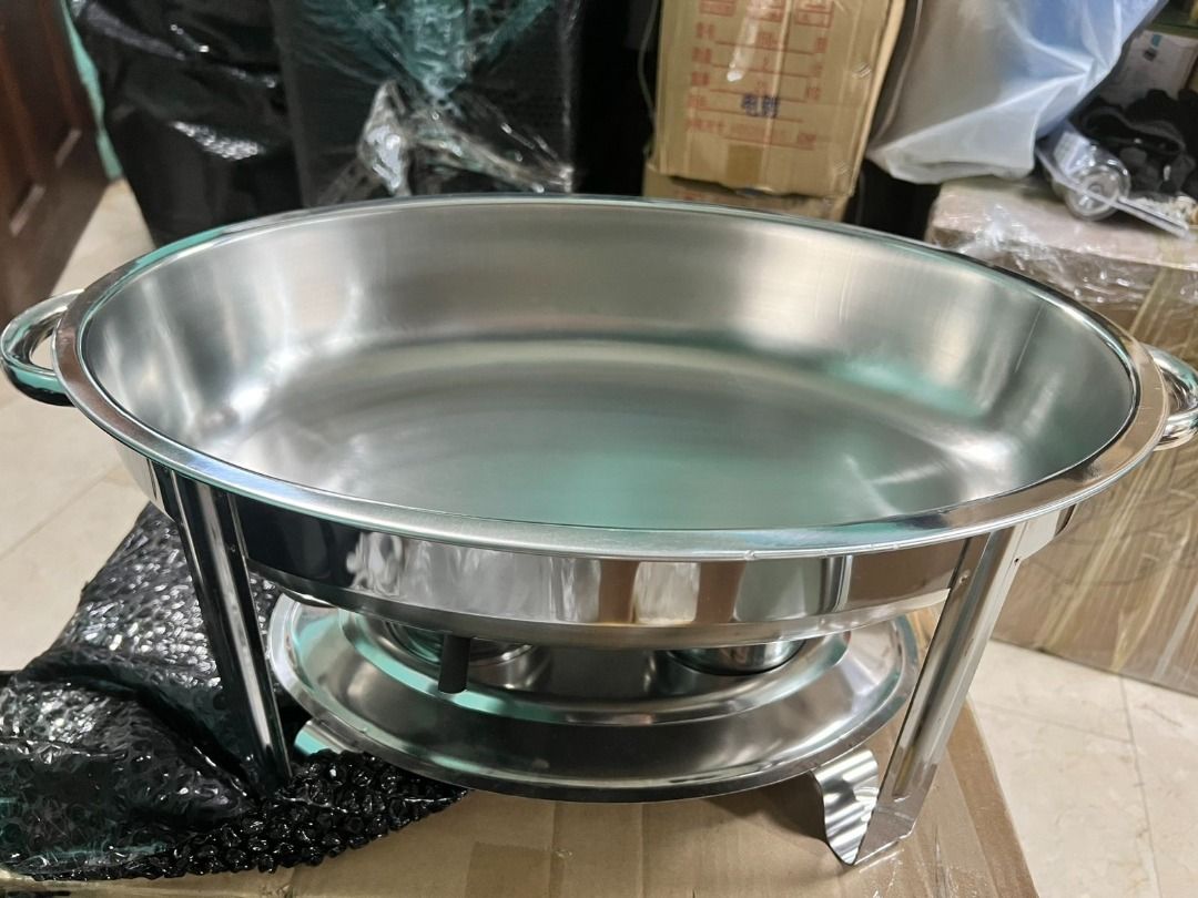 Oval Stainless Steel Chafing Dish Buffet Warmer Set (Category: Other Kitchenware & Tableware) located in Manila. Submitted by makinaryageneral.merchandise (Listing ID 1453447458, Image 3). Description: - Oval chafing dish set made of durable stainless steel. - Complete set includes main dish, stand, fuel holders, and lids. - Ideal for parties, buffets, and gatherings. - Effectively keeps food warm and ready to serve. - Simple to assemble and user
