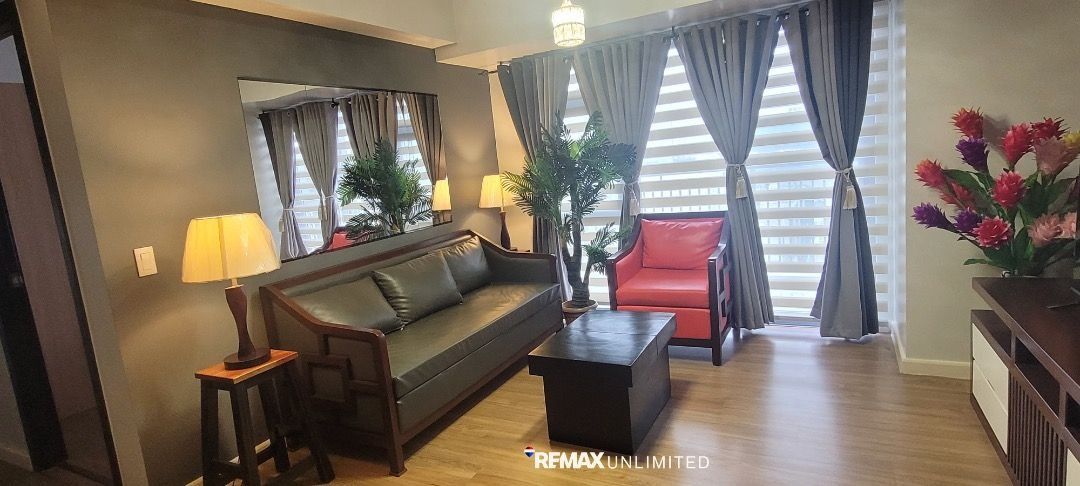 Park Triangle Residences 2BR unit (Category: Apartments & Condos) located in Makati City. Submitted by REMAXUNLIMITEDPH (Listing ID 1453431856, Image 3). Description: Park Triangle Residences 2BR unit 32nd St. corner 11th Ave. BGC A bright and elegant Brand New 2-Bedroom unit located on a high floor, offering an unobstructed view of BGC skyline. Property Description: - 2 Bedrooms corner unit , 82 sqm. - Master bedroom with ensuite toilet and bath