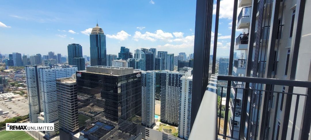 Park Triangle Residences 2BR unit (Category: Apartments & Condos) located in Makati City. Submitted by REMAXUNLIMITEDPH (Listing ID 1453431856, Image 2). Description: Park Triangle Residences 2BR unit 32nd St. corner 11th Ave. BGC A bright and elegant Brand New 2-Bedroom unit located on a high floor, offering an unobstructed view of BGC skyline. Property Description: - 2 Bedrooms corner unit , 82 sqm. - Master bedroom with ensuite toilet and bath