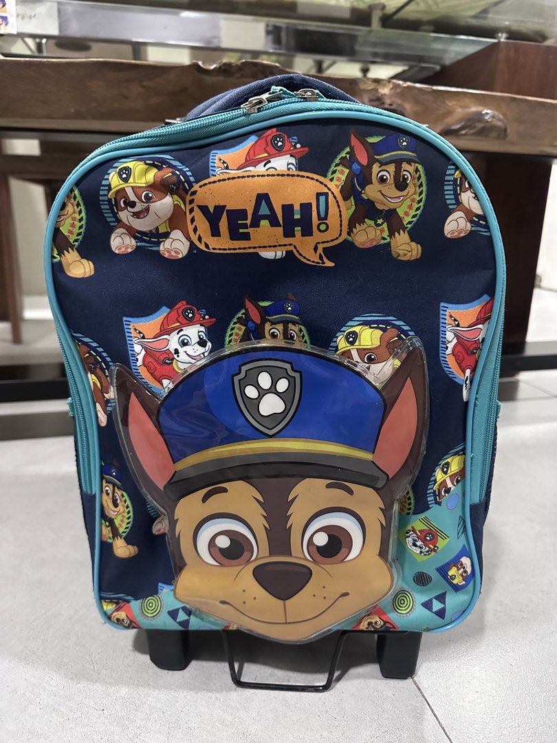 Paw Patrol Chase Rolling Backpack with Detachable Lunch Bag (Category: Babies & Kids Fashion) located in Makati City. Submitted by Pipie (Listing ID 1453433078, Image 3). Description: - Adorable Paw Patrol rolling backpack featuring Chase. - Comes with a matching, detachable lunch bag. - Equipped with wheels and a retractable handle for effortless transport. - Ideal for school, travel, or everyday adventures. - Decorated with multiple Paw Patrol 