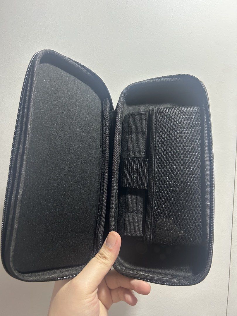 Pokémon Pikachu Action Hard Shell Carrying Case / Travel Case (Nintendo Switch / Accessories) (Category: Nintendo) located in San Juan City. Submitted by kera.g815 (Listing ID 1453485164, Image 2). Description: Level up your gaming setup or travel gear with this awesome 3D embossed Pikachu carrying case! Designed with a sleek black hard shell featuring dynamic grey energy-burst patterns and a vibrant 3D raised Pikachu on the front, this case keep