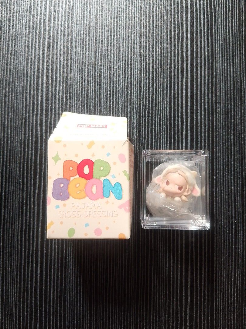 Pop Mart Pop Bean Pajama Cross Dressing Blind Box Figure (Category: Designer & Blind Box Toys) located in Quezon City. Submitted by osaki.drew (Listing ID 1453542948, Image 1). Description: - Pop Mart Pop Bean blind box figure - From the Pajama Cross Dressing series - Features a cute sheep character - Comes in original box and protective casing - Ideal for collectors or as a fun gift.