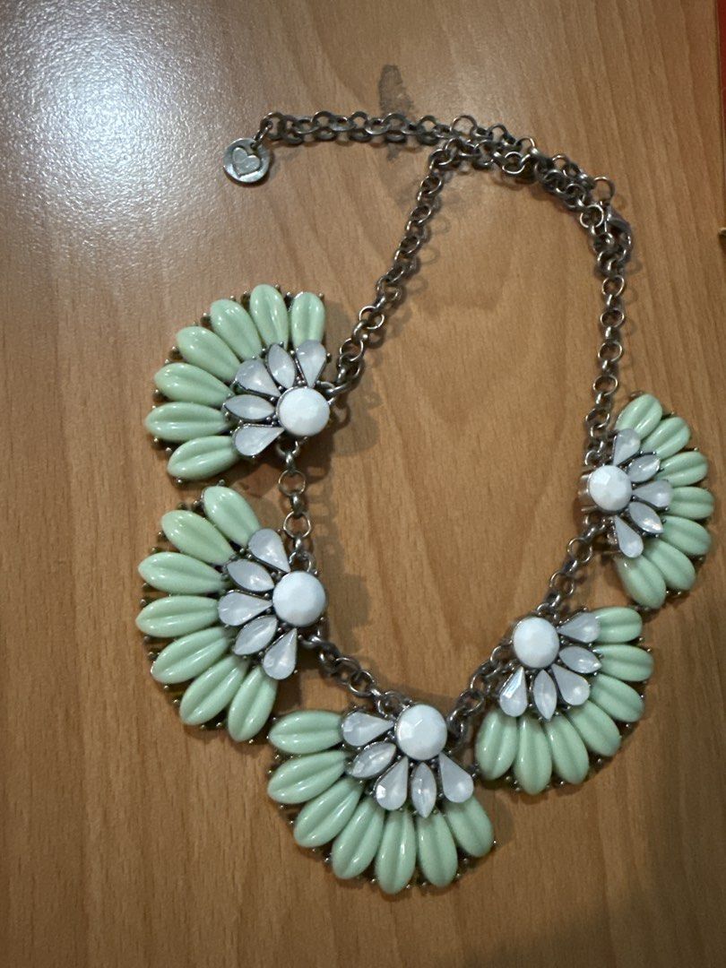 Promod Mint Green Flower Statement Necklace (Category: Necklaces) located in Manila. Submitted by eicho (Listing ID 1453595541, Image 2). Description: - Chunky statement necklace - Features mint green flower details - Each flower has a white gem in the center - Silver-tone chain - Secure lobster clasp closure - Adds a vibrant pop of color to any outfit.