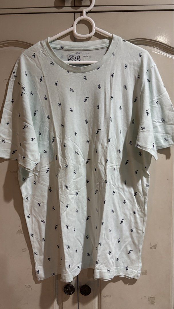 Pull & Bear Light Blue All-Over Print T-Shirt Size L (Category: Tshirts & Polo Shirts ) located in Manila. Submitted by daisiestuffph (Listing ID 1453580188, Image 1). Description: - Light blue t-shirt from Pull & Bear - Features a repeating dark blue graphic print all over - Crew neck, short sleeves - Made in Bangladesh - Comfortable for everyday wear.