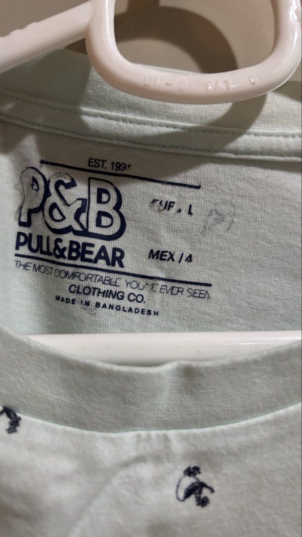 Pull & Bear Light Blue All-Over Print T-Shirt Size L (Category: Tshirts & Polo Shirts ) located in Manila. Submitted by daisiestuffph (Listing ID 1453580188, Image 2). Description: - Light blue t-shirt from Pull & Bear - Features a repeating dark blue graphic print all over - Crew neck, short sleeves - Made in Bangladesh - Comfortable for everyday wear.