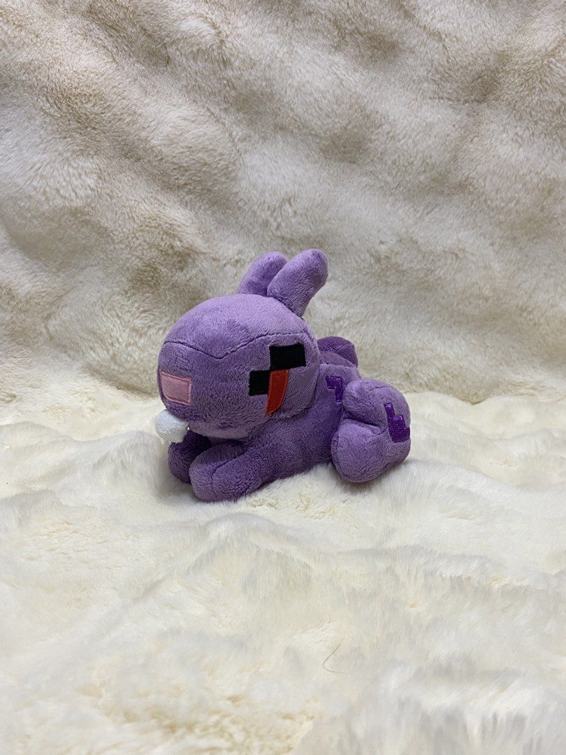 Purple Minecraft Rabbit Plush Toy (Category: Plushies & Soft Toys) located in Kalibo. Submitted by ollie_stuffshop (Listing ID 1453450873, Image 1). Description: 14cm x 14cm x 15cm Before you send your inquiries: ❗️Last Price is already posted ❗️Manage your expectations, WYSIWYG ❗️May need washing ❗️Shipping day is every Sunday - Adorable purple plush toy - Resembles a Minecraft rabbit - Features a convenient keychain attachment - Super soft and 