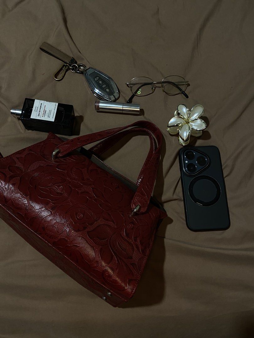Red Embossed Leather Handbag with Floral Design (Category: Luxury Bags & Wallets) located in Manila. Submitted by cdb_22 (Listing ID 1453614190, Image 1). Description: - Stunning red leather handbag - Intricate floral embossed pattern all over - Comfortable, good-length handles for carrying - Structured design, ideal for everyday use - Ample interior space for essentials - A versatile, classic piece that complements many outfits.