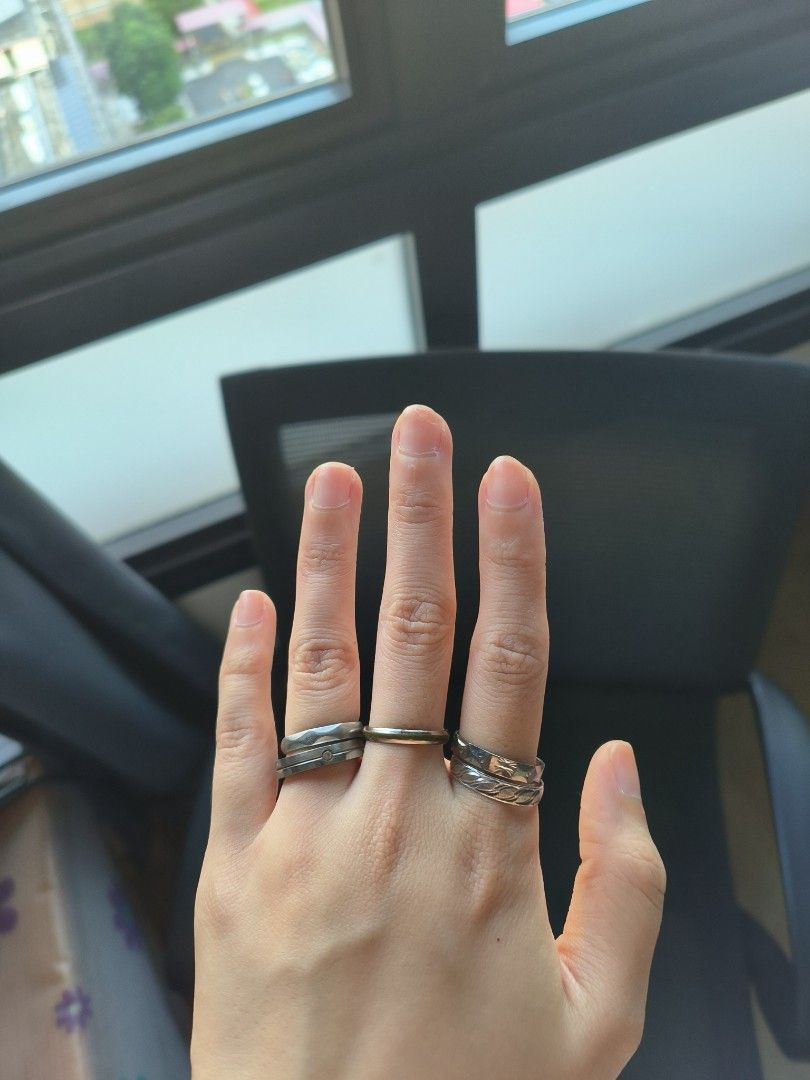 Rings (Category: Rings) located in Singapore. Submitted by foodcaptures (Listing ID 1453536699, Image 3). Description: - Set of silver-toned rings - Features various designs, including a leaf pattern - Visible signs of wear, but in good overall condition - Suitable for stacking or individual wear - Meetup available at Redhill MRT Station.