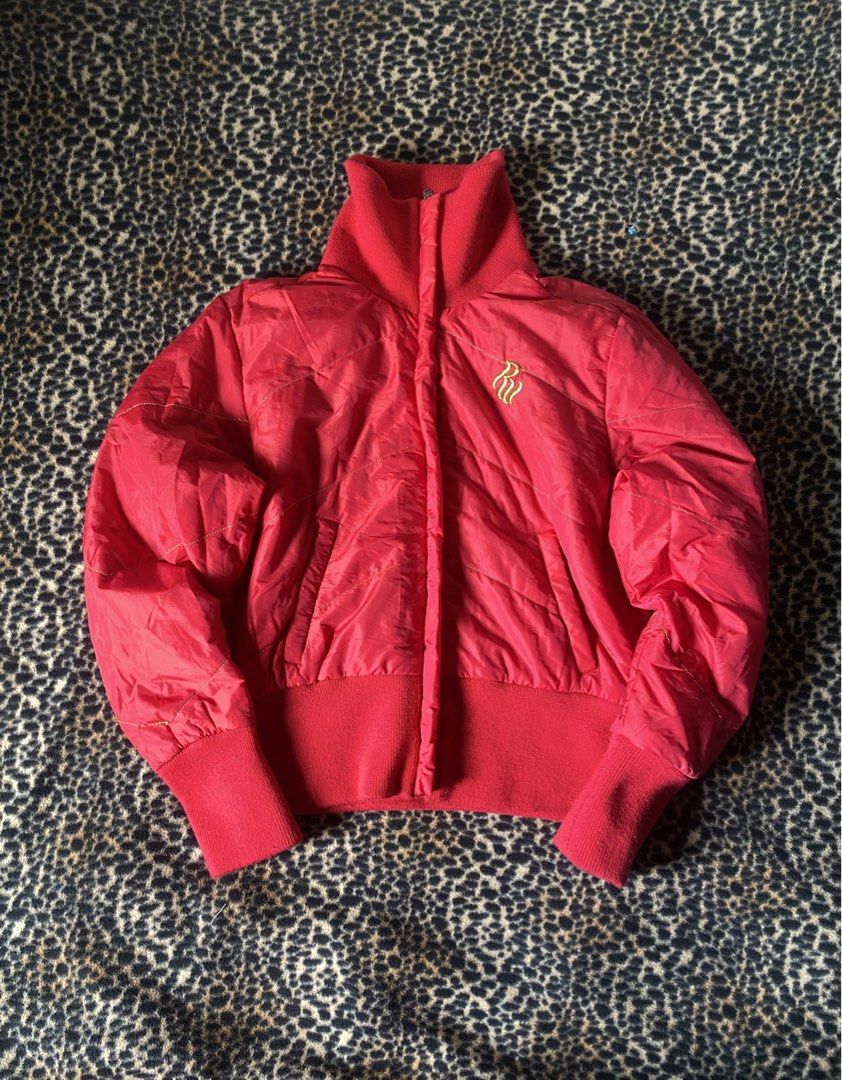 Rocawear Red Puffer Jacket with Crown Logo (Category: Coats, Jackets and Outerwear) located in Cabuyao City. Submitted by heran_nn (Listing ID 1453437940, Image 1). Description: W23 L24 - Cool red puffer jacket from Rocawear. - Features a high neck and ribbed cuffs. - Detailed crown and Rocawear logo on the back. - Lined with a repeating Rocawea pattern. - A great statement piece for your wardrobe. .