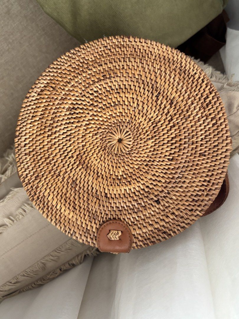 Round Rattan Bag with Leather Detail (Category: Shoulder Bags) located in Las Pinas. Submitted by yonohu (Listing ID 1453476385, Image 1). Description: - Cute round rattan bag - Woven design - Small leather closure - Ideal for beach trips or casual outings - Lightweight and stylish - Perfect accessory for summer outfits RFS: not used Mode of Payment: -Bank Transfer -Gcash -Maya.