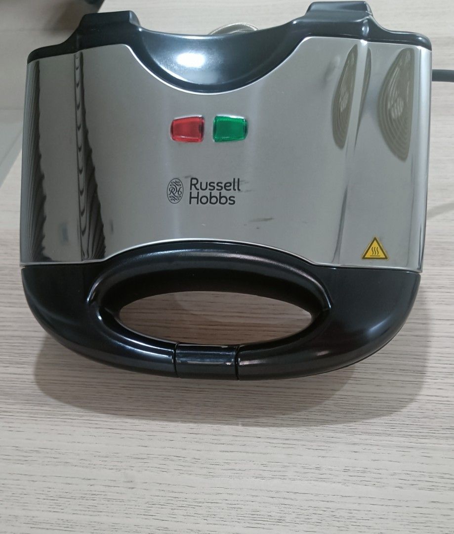 Russel Hobbs Sandwich Maker (Category: Ovens & Toasters) located in Manila. Submitted by taguigsulitfinds (Listing ID 1453460670, Image 1). Description: FOR SALE: Russell Hobbs Sandwich Maker 🥪✨ Price: ₱1,200 💸 Condition:** Slightly Used (Sleek, well-maintained, and perfectly working) Specifications & Key Features: * Brand & Model: Russell Hobbs (Model 17936) * Power Output: 700 Watts (230V ~ 50Hz) * Capacity: 2 Slices / 4 Pocket Triangles * Pl
