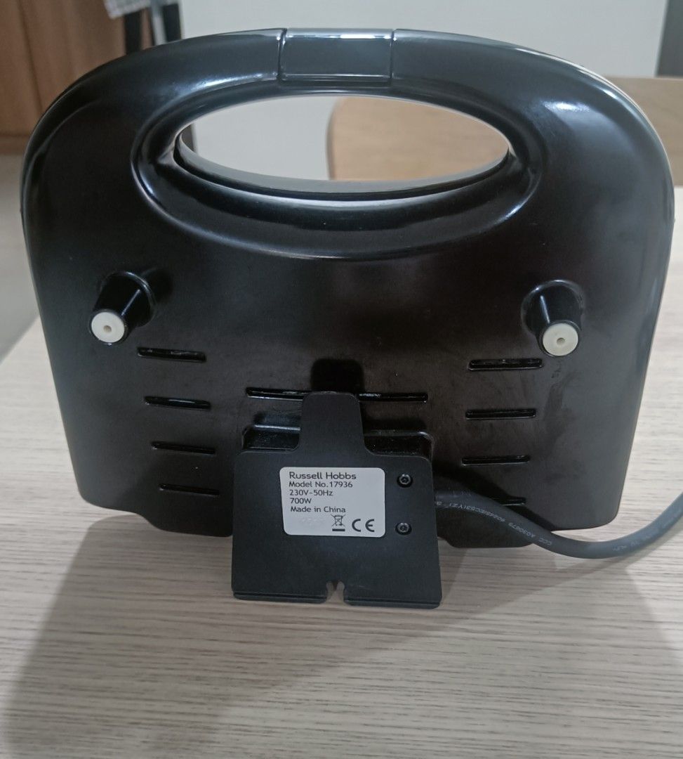 Russel Hobbs Sandwich Maker (Category: Ovens & Toasters) located in Manila. Submitted by taguigsulitfinds (Listing ID 1453460670, Image 3). Description: FOR SALE: Russell Hobbs Sandwich Maker 🥪✨ Price: ₱1,200 💸 Condition:** Slightly Used (Sleek, well-maintained, and perfectly working) Specifications & Key Features: * Brand & Model: Russell Hobbs (Model 17936) * Power Output: 700 Watts (230V ~ 50Hz) * Capacity: 2 Slices / 4 Pocket Triangles * Pl