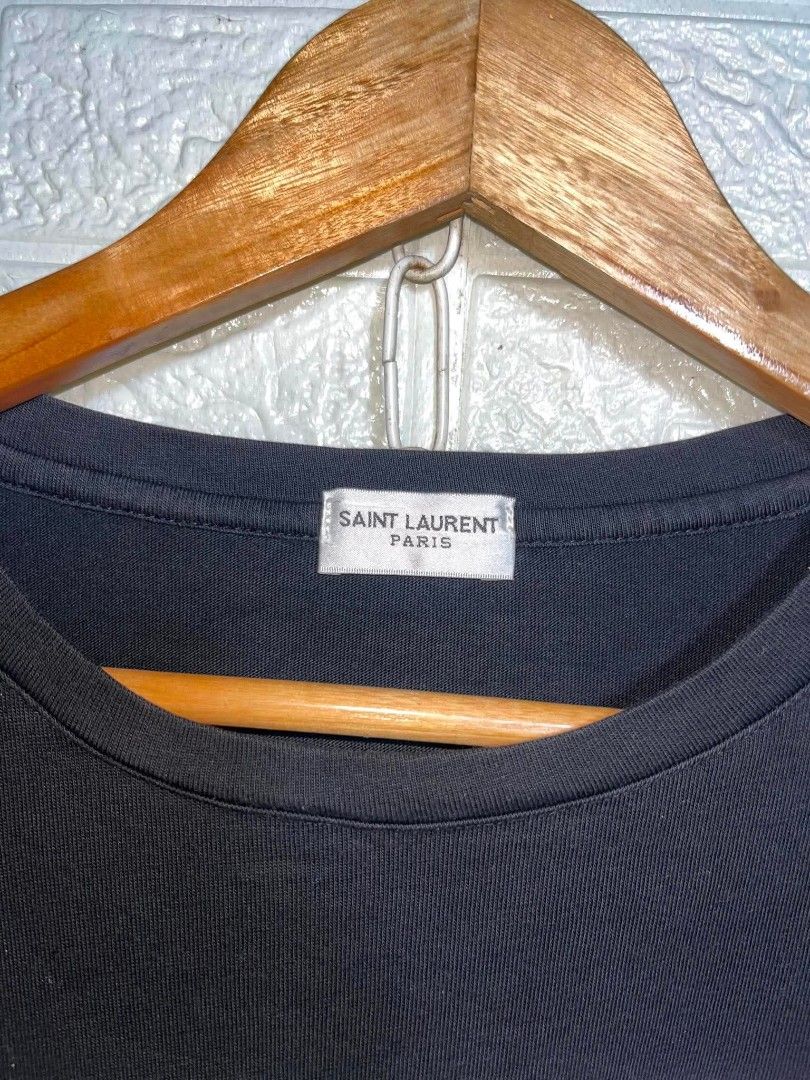 Saint Laurent Paris "Baby" Graphic Tee (Category: Shirts) located in Manila. Submitted by mikay_thrift (Listing ID 1453480926, Image 3). Description: - Authentic Saint Laurent Paris T-shirt - Features the iconic 'Baby' graphic print - Made in Italy - Size: Medium (M) - Ideal for casual and stylish everyday wear.