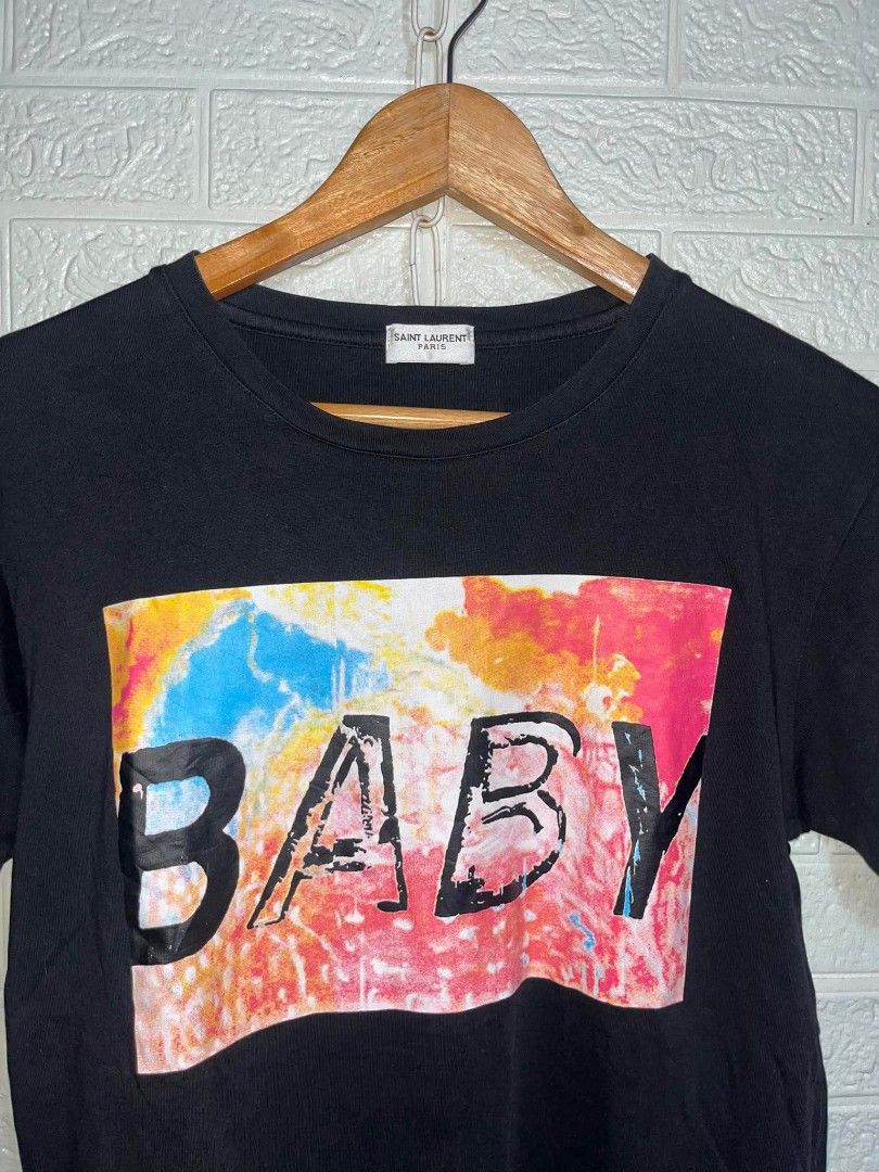 Saint Laurent Paris "Baby" Graphic Tee (Category: Shirts) located in Manila. Submitted by mikay_thrift (Listing ID 1453480926, Image 2). Description: - Authentic Saint Laurent Paris T-shirt - Features the iconic 'Baby' graphic print - Made in Italy - Size: Medium (M) - Ideal for casual and stylish everyday wear.