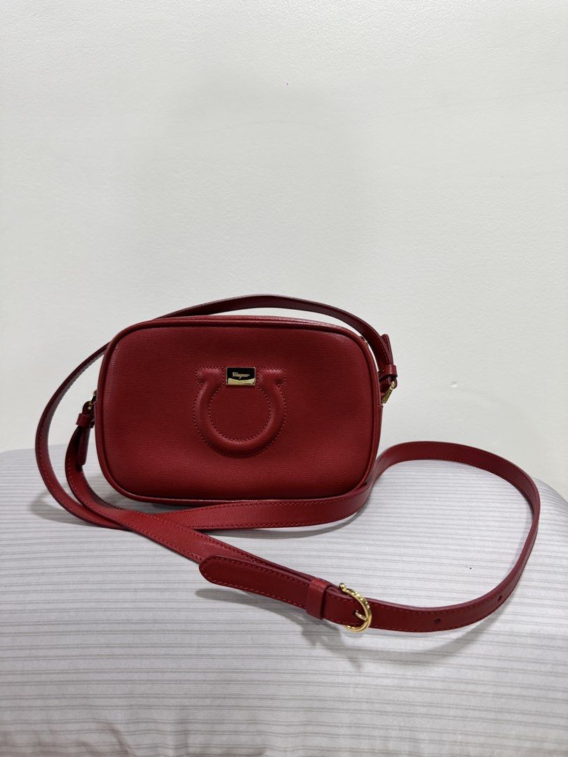 Salvatore Ferragamo Red Leather Gancini Camera Bag (Category: Luxury Bags & Wallets) located in Mandaluyong City. Submitted by rdangeles18 (Listing ID 1453518882, Image 1). Description: Salvatore Ferragamo Gancini City Camera Bag Authentic Slightly negotiable. Transaction options: • Meet-up: SM Megamall or Centerpoint Building, Ortigas Center • Delivery via Lalamove or Grab (shipping fee to be shouldered by the buyer) Full payment is required bef