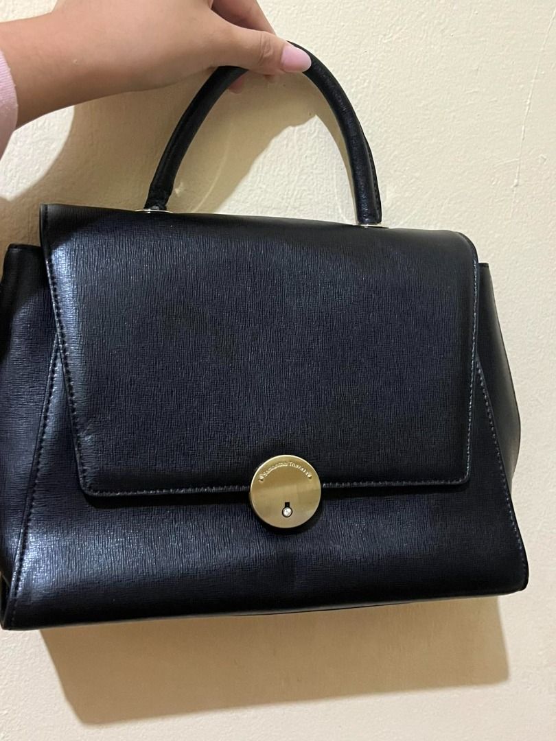 Samantha Thavasa Black Leather Top Handle Bag (Category: Luxury Bags & Wallets) located in Manila. Submitted by mela020 (Listing ID 1453601998, Image 3). Description: - Brand: Samantha Thavasa - Material: Black Leather - Design: Structured top handle bag - Hardware: Circular gold-tone clasp with gem detail - Interior: Clean - Occasion: Ideal for daily use or special events.