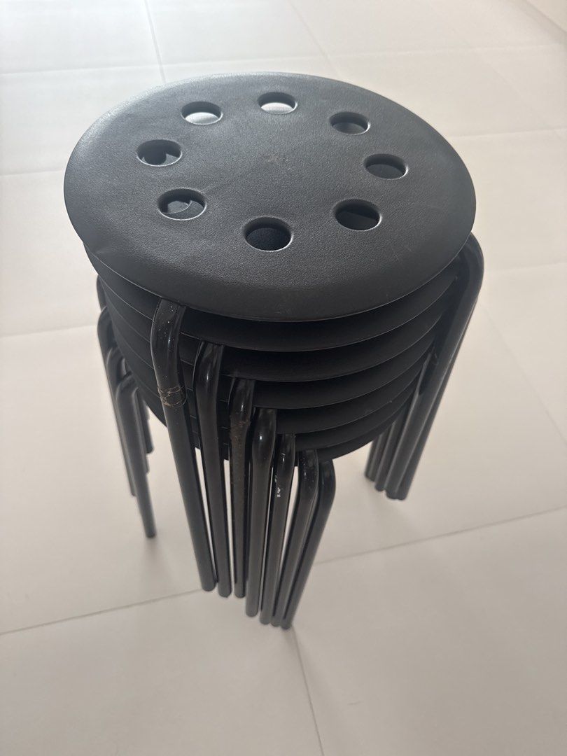Black Stackable Round Stools (Category: Chairs) located in Singapore. Submitted by jlbenthong (Listing ID 1453450898, Image 2). Description: Clearing store.. 7 stools 1 stool $3.50 7 stools $20.00 Not for fussy buyer. Self collect only at Blk 302 Hougang Ave 5 Postal code 530302. - black stools - Stackable for easy storage - Circular seats with hole pattern - Sturdy metal legs - Ideal for extra seating at home or events.