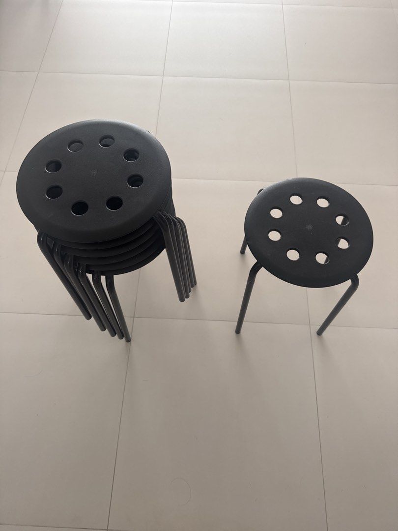Black Stackable Round Stools (Category: Chairs) located in Singapore. Submitted by jlbenthong (Listing ID 1453450898, Image 3). Description: Clearing store.. 7 stools 1 stool $3.50 7 stools $20.00 Not for fussy buyer. Self collect only at Blk 302 Hougang Ave 5 Postal code 530302. - black stools - Stackable for easy storage - Circular seats with hole pattern - Sturdy metal legs - Ideal for extra seating at home or events.