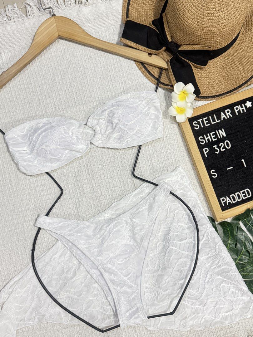 SHEIN White Textured Bandeau Bikini Set P320 (Category: Bikinis & Swimsuits) located in Manila. Submitted by camillestc (Listing ID 1453483412, Image 1). Description: - White textured bikini set from SHEIN - Bandeau top with ruched detail - Padded top for extra support - Matching bikini bottoms - Size Small to Medium - Ideal for beach or pool days - Sold as a complete set.