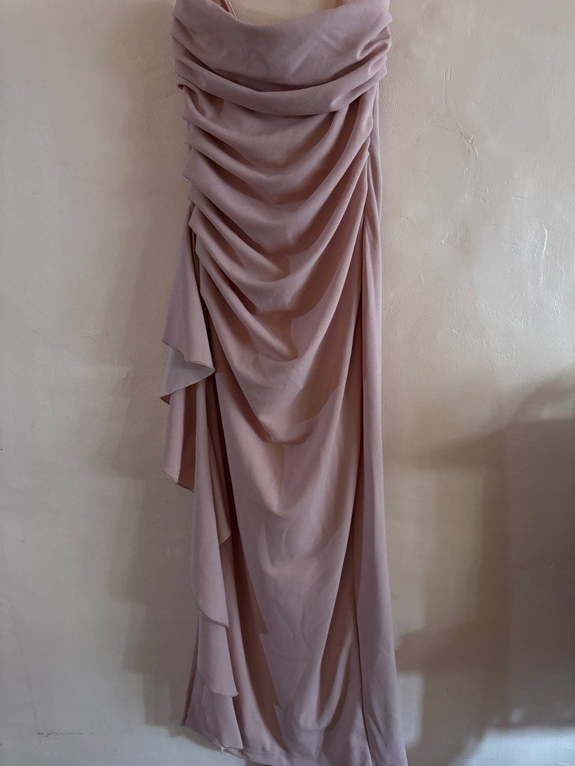 Strapless Ruched Gown with Waterfall Skirt (Category: Evening dresses & gowns) located in Pasig City. Submitted by klaaaaa (Listing ID 1453479602, Image 1). Description: - Long strapless dress - Soft blush/taupe color - Ruched bodice - Cascading waterfall detail on skirt - Floor length - Ideal for formal events or as a bridesmaid dress.