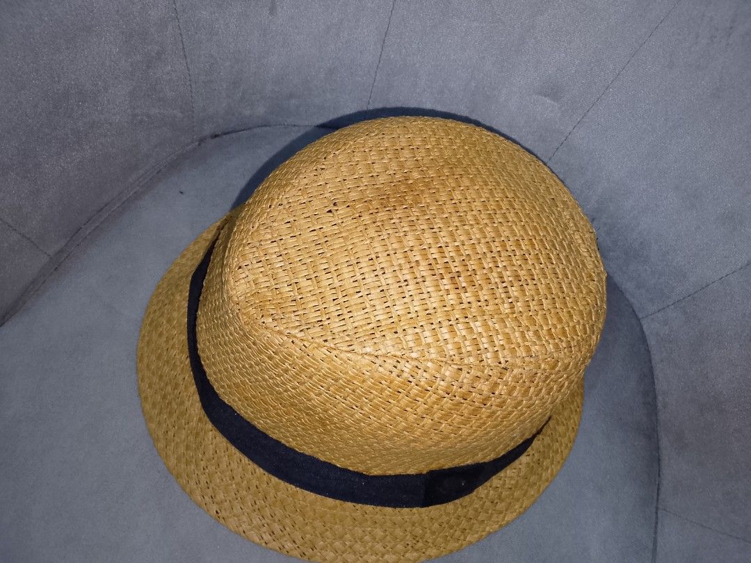 Straw Fedora Hat with Black Band (Category: Hats & Beanies) located in Binangonan. Submitted by yuristalin888 (Listing ID 1453562837, Image 3). Description: - Classic straw fedora hat - Woven texture all over - Features a dark blue band around the crown - Ideal for sunny days - Versatile style for casual or dressy outfits.