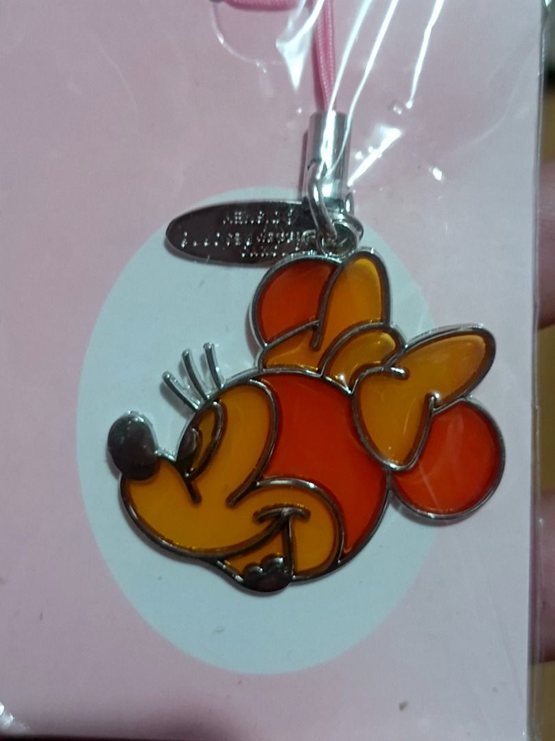Tokyo Disney Resort Minnie Mouse Charm (Category: Charms) located in Makati City. Submitted by nyxhemera26 (Listing ID 1453616143, Image 2). Description: Tokyo Disney Resort Minnie Mouse Charm - Authentic Tokyo Disney Resort Minnie Mouse charm - Features vibrant orange and red enamel details - Comes with a cute pink strap - Includes a metal tag for authenticity - Perfect accessory for your phone or bag.
