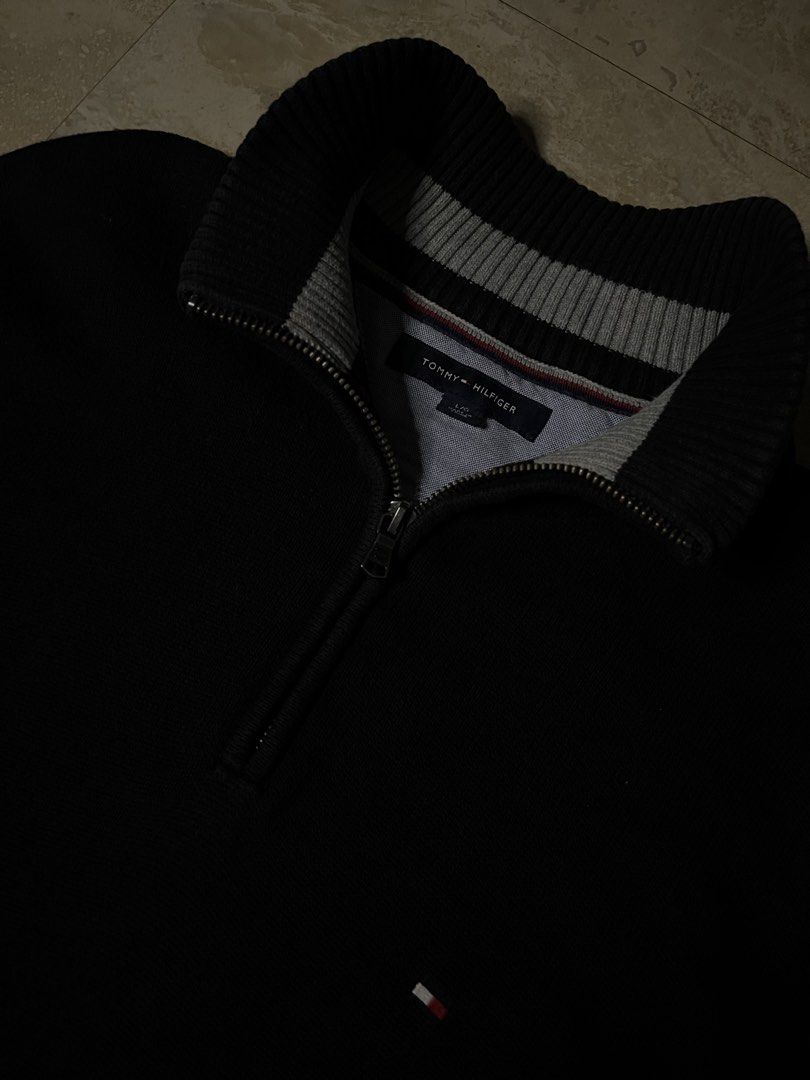 Tommy Hilfiger Black 1/4 Zip Sweater (Category: Coats, Jackets and Outerwear) located in Magsaysay. Submitted by dlardfinds25 (Listing ID 1453622399, Image 3). Description: - Classic black Tommy Hilfiger sweater - Features a 1/4 zip neckline - Ribbed cuffs and hem - Small Tommy Hilfiger flag logo on the chest - Comfortable knit material - Ideal for layering or wearing solo Dimes - 22by29.